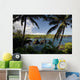 Hawaii, Maui, A sunny view of Waianapanapa from behind palm trees Wall Mural