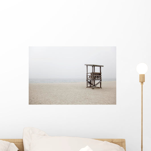 Abandoned lifeguard station on beach Wall Mural