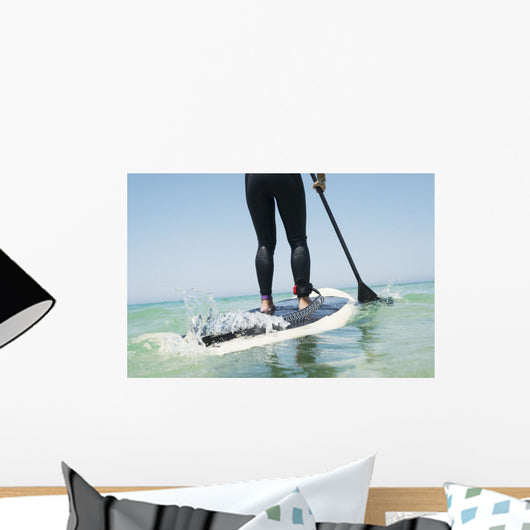Paddling on a surfboard;Tarifa cadiz andalusia spain Wall Mural