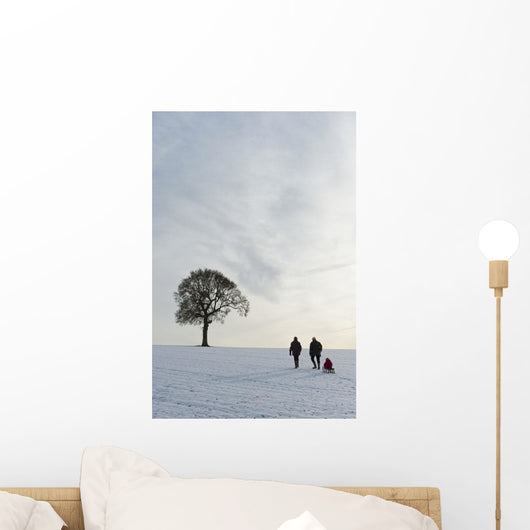 Couple Pulling Child Sledge Wall Decal