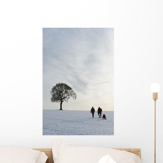 Couple Pulling Child Sledge Wall Decal
