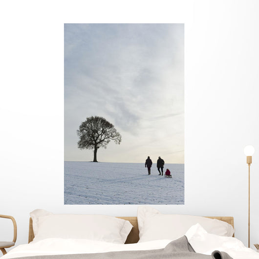 Couple Pulling Child Sledge Wall Decal