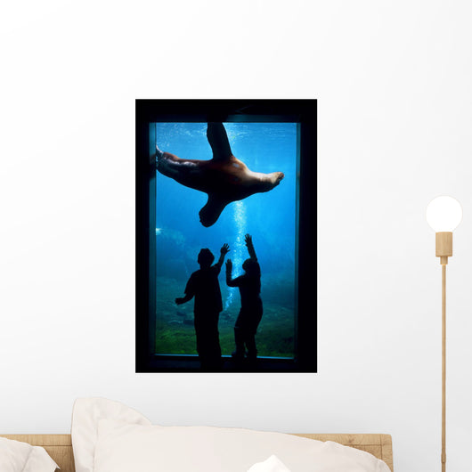 Silhouette Of Children Watching A Sea Lion Wall Mural