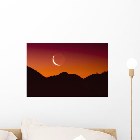 Sunrise over a mountain range Wall Mural