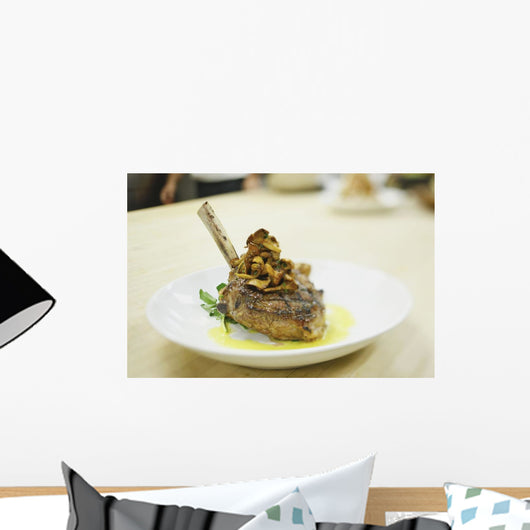 Lamb chop on a plate in a restaurant Wall Mural
