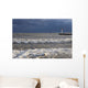 Storm waves crashing on a beach near a lighthouse on lake ontario Wall Mural