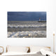 Storm waves crashing on a beach near a lighthouse on lake ontario Wall Mural