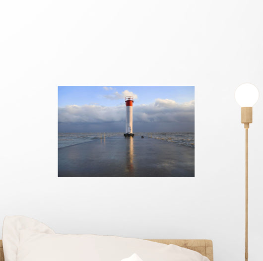 Lighthouse reflected on a wet pier on a stormy day by lake ontario Wall Mural