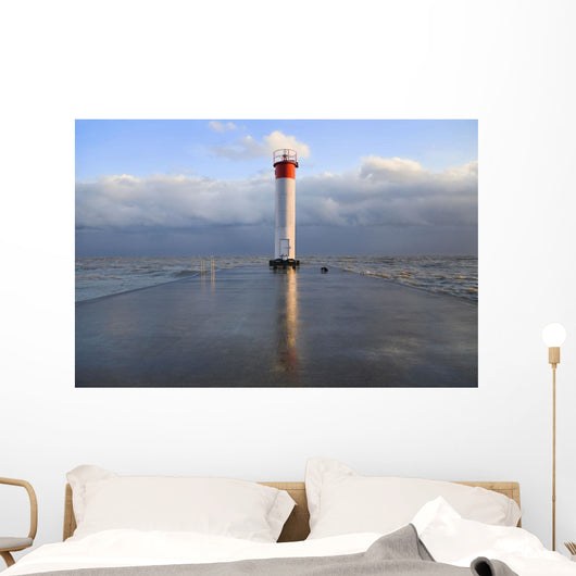 Lighthouse reflected on a wet pier on a stormy day by lake ontario Wall Mural