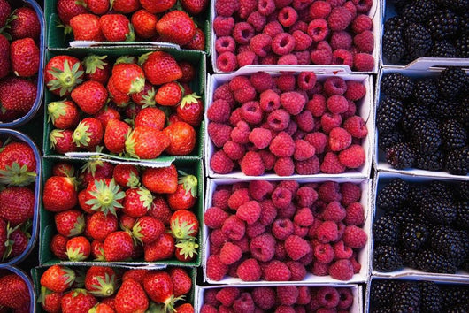 Berries in boxes at a food market;Sault vaucluse provence france Wall Mural