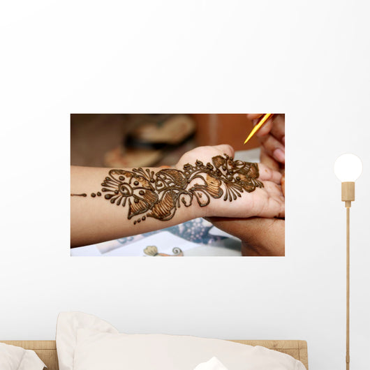 Applying henna on hand Wall Mural