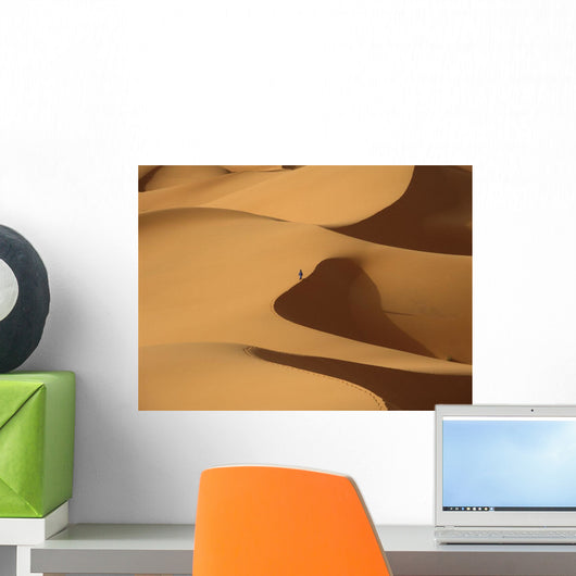 Berber 'blue man' walking through sand dunes in Erg Chebbi area Wall Mural
