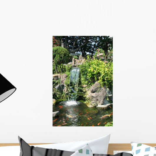 Waterfall and Koi pond in an Asian garden Wall Mural