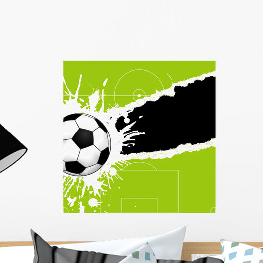 Soccer ball on torn paper Wall Mural