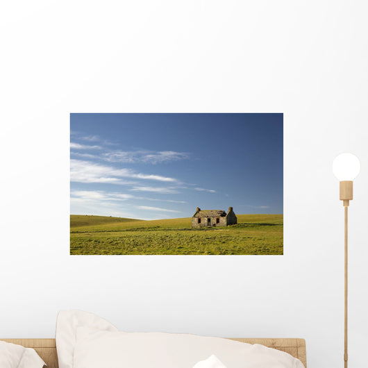 An abandoned farm building alone Wall Mural