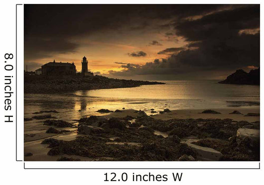 Silhouette of a lighthouse along the coast Wall Mural