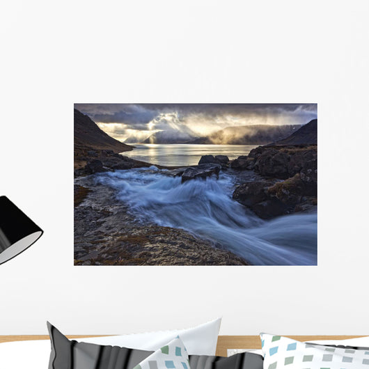A stormy sky breaks above the Arnarfjorour fjord Wall Mural