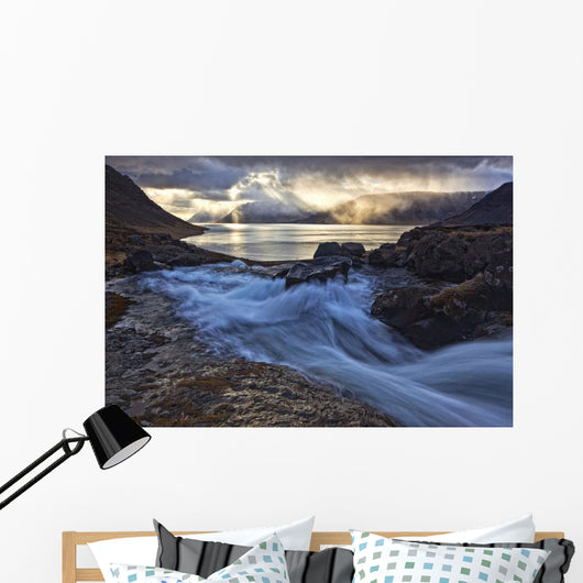 A stormy sky breaks above the Arnarfjorour fjord Wall Mural