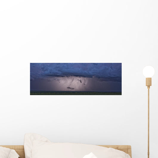 An intense thunderstorm races across the prairies Wall Mural
