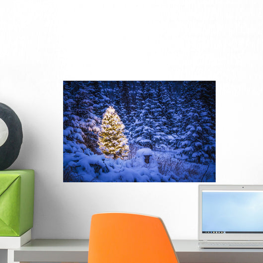 Lit Christmas Tree In Snow Covered Forest Of Spruce Trees Wall Mural
