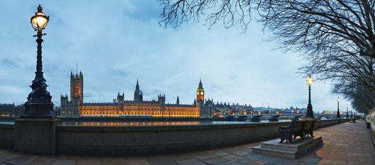 UK, Panoramic view of Houses of Parliament at dusk from River Thames Wall Mural