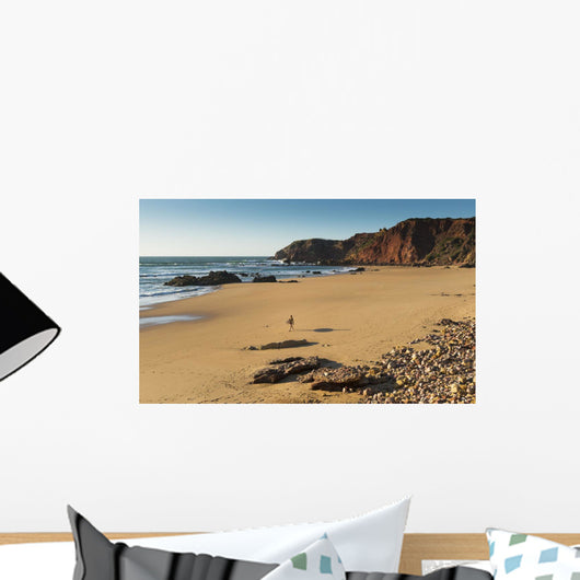 Portugal, Algarve, Distant View Of Surfer Walking On Playa Do Amado Wall Mural