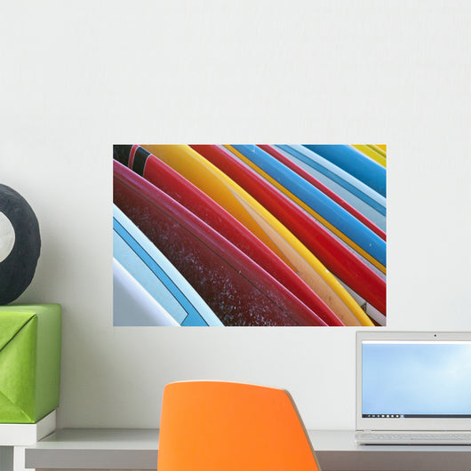 Close up of coloured surfboards lined up Wall Mural