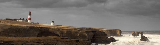 A lighthouse and cliffs Wall Mural