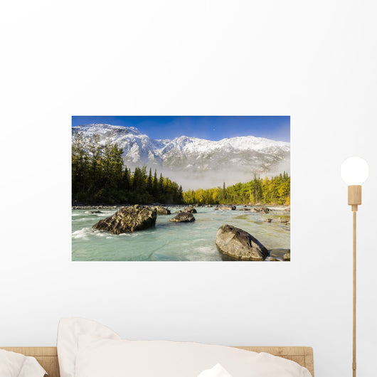 Autumn's colors contrast with winter's first snow Wall Mural