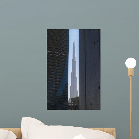 Looking between two tall office buildings to the Burj Khalifa Wall Mural
