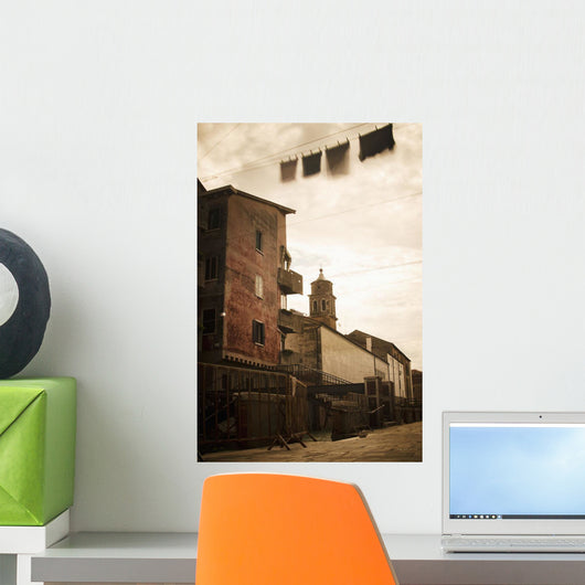Long exposure of clothing drying on a clothesline moving Wall Mural