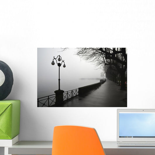 Lamp post and trees on a promenade along Lake Maggiore Wall Mural
