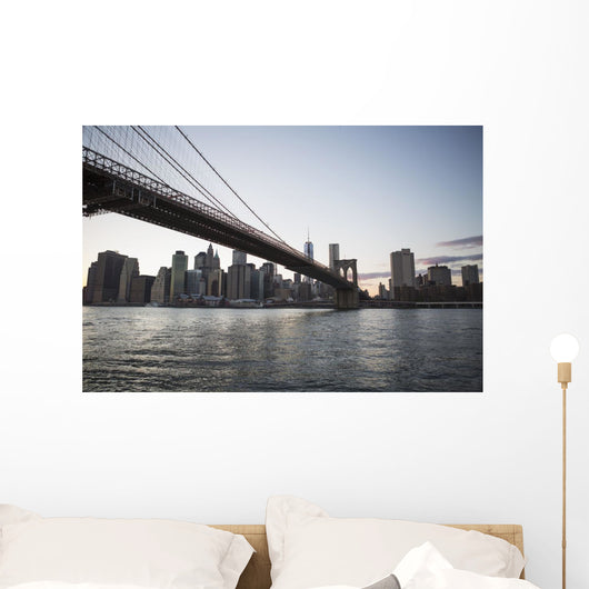 Brooklyn Bridge heading into Manhattan at dusk Wall Mural