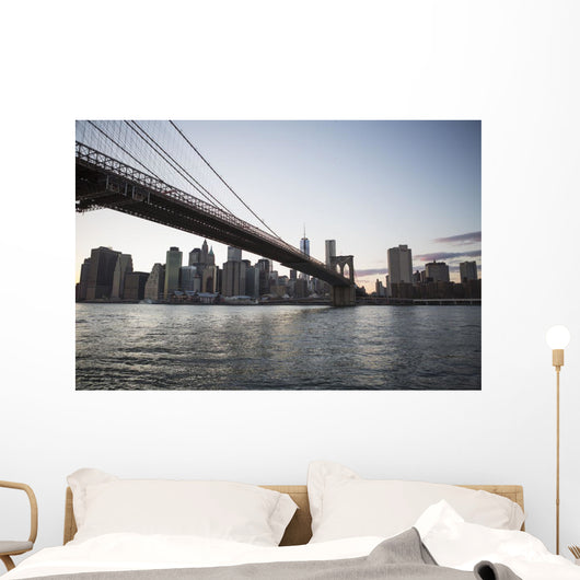Brooklyn Bridge heading into Manhattan at dusk Wall Mural