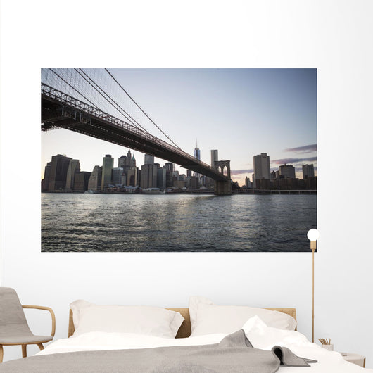 Brooklyn Bridge heading into Manhattan at dusk Wall Mural