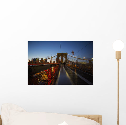 Pedestrian path on Brooklyn Bridge heading into Manhattan at night Wall Mural