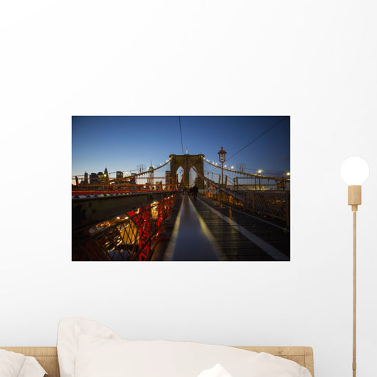 Pedestrian path on Brooklyn Bridge heading into Manhattan at night Wall Mural