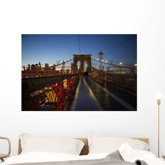 Pedestrian path on Brooklyn Bridge heading into Manhattan at night Wall Mural