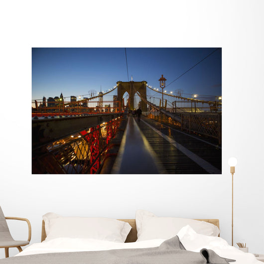 Pedestrian path on Brooklyn Bridge heading into Manhattan at night Wall Mural