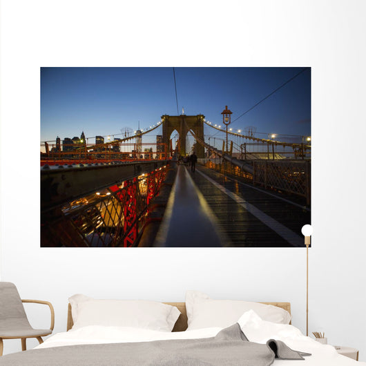 Pedestrian path on Brooklyn Bridge heading into Manhattan at night Wall Mural