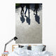 Pedestrians and their shadows on a walkway Wall Mural