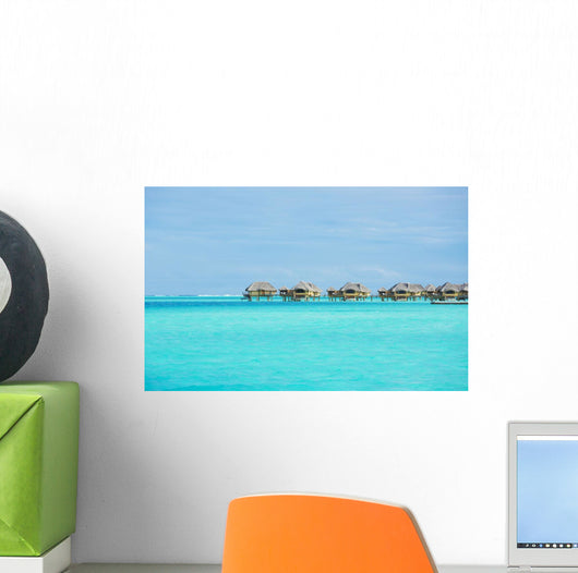 Over-water bungalows at a tropical resort Wall Mural
