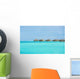 Over-water bungalows at a tropical resort Wall Mural