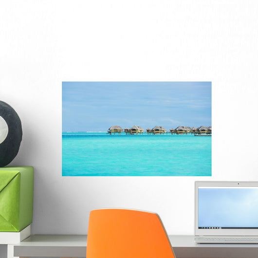 Over-water bungalows at a tropical resort Wall Mural