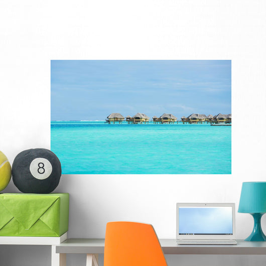 Over-water bungalows at a tropical resort Wall Mural