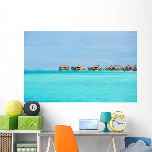 Over-water bungalows at a tropical resort Wall Mural