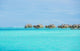 Over-water bungalows at a tropical resort Wall Mural