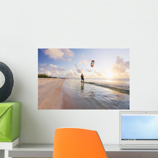 Kiteboarding in tropical lagoon in the South Pacific at sunset Wall Mural