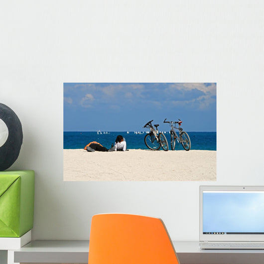 Young Interracial Couple Relaxing on the Beach Wall Mural