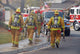 fire fighters heading to a fire Wall Mural